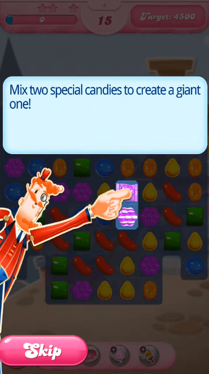 Candy Crush mascot pointing at two striped candies under the instruction to mix them into a giant one