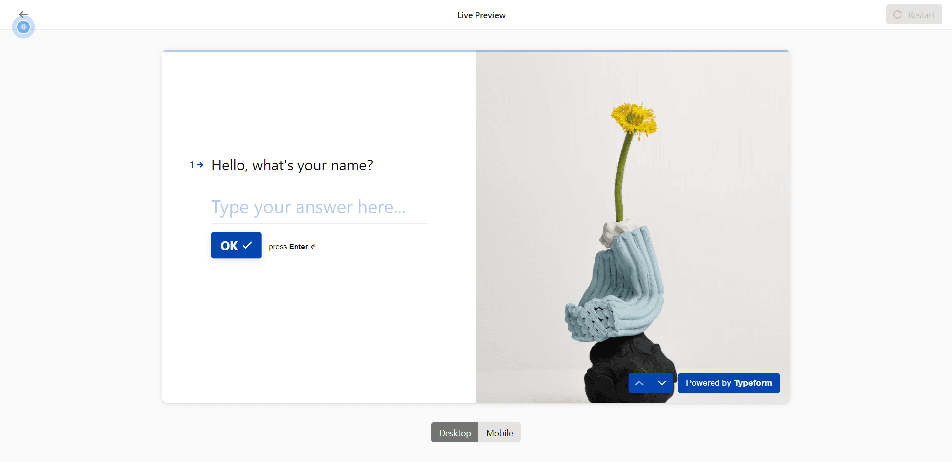 Typeform live preview with Desktop and Mobile toggles and a hotspot on the back arrow