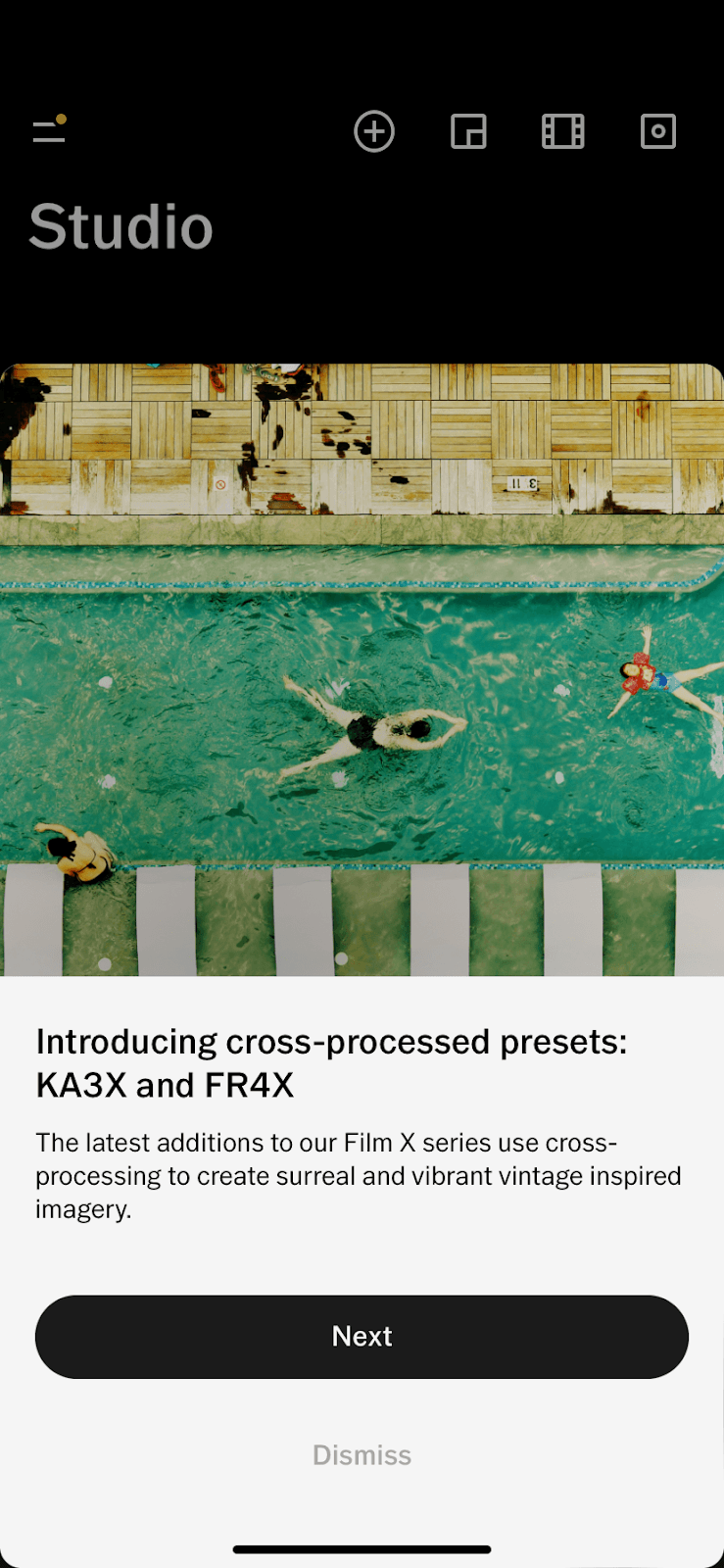 VSCO slideout introducing cross-processed presets KA3X and FR4X over a photo of swimmers in a pool, with Next and Dismiss