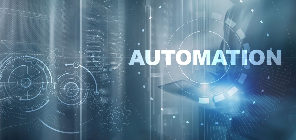 Stock image of the word automation over gears and a server room