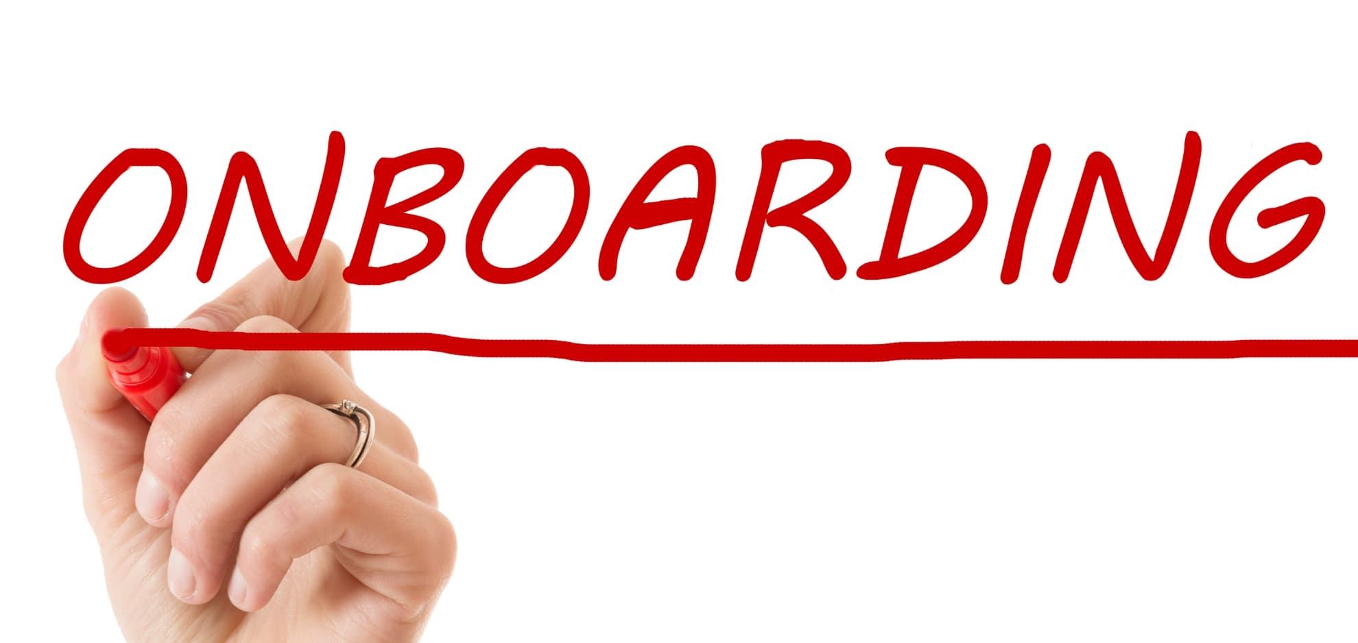 A hand writing the word onboarding in red marker